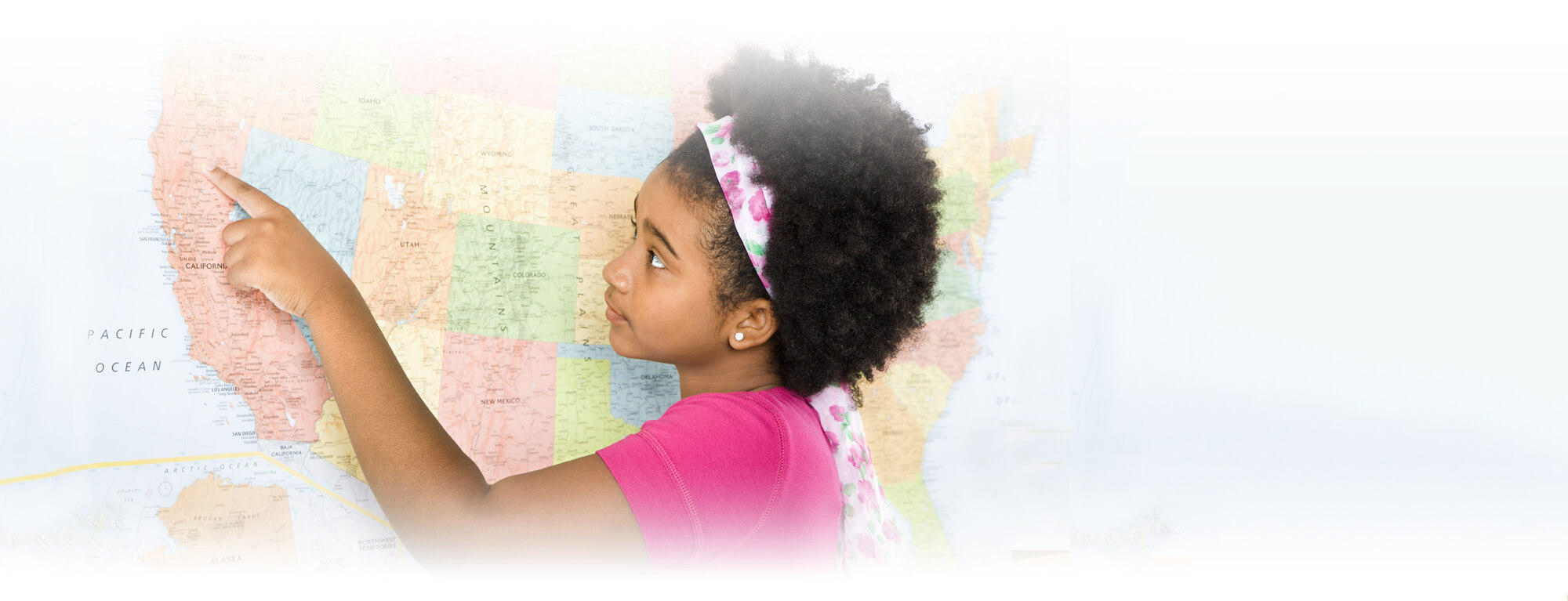 student girl pointing at map of the United States
